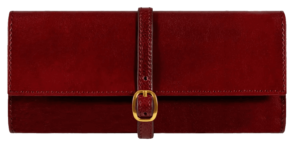 Viaggio Roll closed: a burgundy leather jewelry case fastened with a brass buckle.